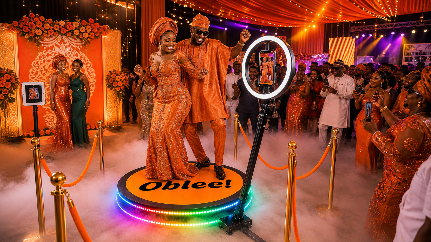 Couple celebrating on an Oblee 360 photobooth platform
